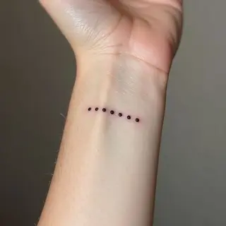 The Meaning Behind a 3 Dot Tattoo on Your Wrist