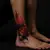 Black and Red Surreal Ankle Tattoos: A Bold Statement
