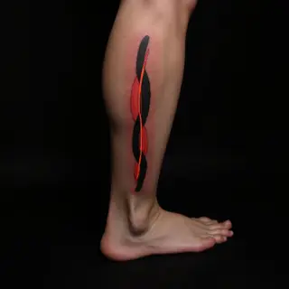 Bloodline Ink Tattoo: A Black and Grey Legacy on Your Leg