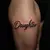 Elegant Child Name Tattoos for Men: Fine Line Thigh Designs