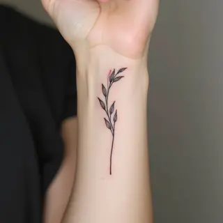 Delicate Botanical Fine Line Tattoo on Wrist
