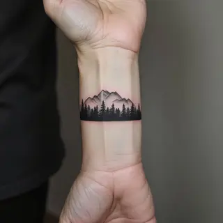 Minimalist Landscape Wrist Tattoo: A Mountain Vista