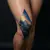 Striking Abstract Knee Tattoo Designs in Blue and Gold