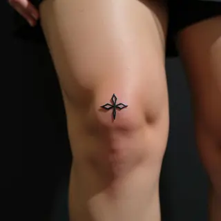 Delicate Mother Symbol Tattoo: A Small Knee Design in Yellow