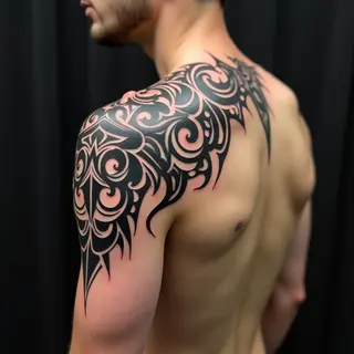 Dynamic Shoulder Tribal Tattoo Design