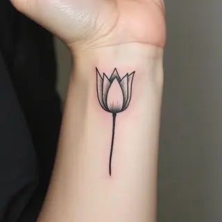 Delicate Tulip Wrist Tattoo: A Floral Aesthetic