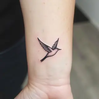 Small Bird Tattoo Ideas: Symbolism & Design Inspiration