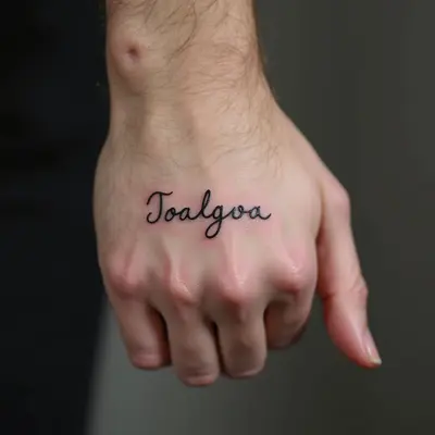Small Word Hand Tattoos for Men: Meaning & Inspiration