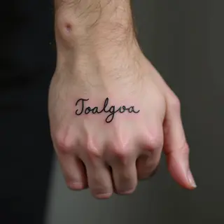 Small Word Hand Tattoos for Men: Meaning & Inspiration