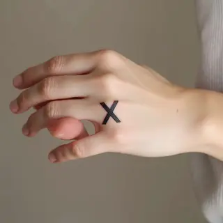 Small X Tattoo on Hand: Meaning & Design Inspiration